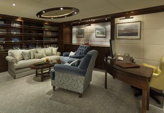 library with seating and desk aboard motor yacht Lauren L 