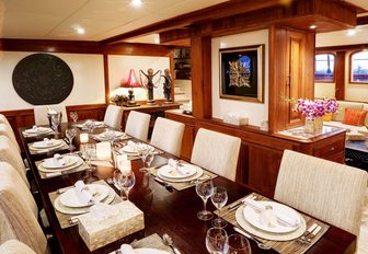 formal dining table in main salon of charter yacht Mutiara Laut 
