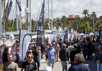 visitors stroll alongside the yachts at the Palma Superyacht Show in Mallorca
