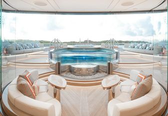 seating looking out over the pool on board charter yacht Kismet