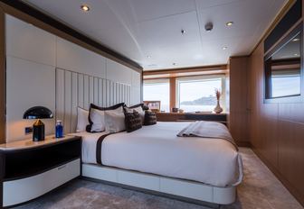master suite with large bed on board charter yacht GO