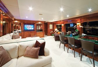 bar and sofa seating in the skylounge aboard motor yacht One More Toy 