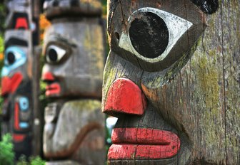 close up of totem poles in Thunderbird Park, Victoria, Canada