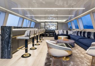 The bar and seating options available in the sky lounge of luxury yacht Da Vinci
