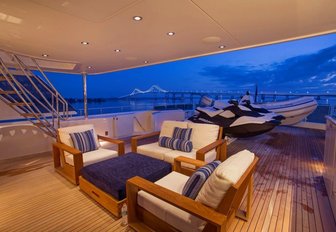 alfresco lounge and tenders on the upper deck aft of charter yacht Far Niente