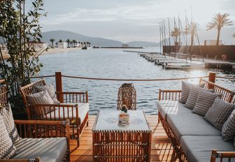luxe seating and tables on waterfront at PMYC Beach in Montenegro