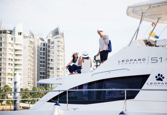 visitors relax on board a Leopard 51 yacht at the Singapore Yacht Show