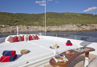 Sunpads on sundeck of superyacht big change ii, with views of Mediterranean in background