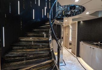 LILIUM luxury yacht main staircase with lightbars on the walls