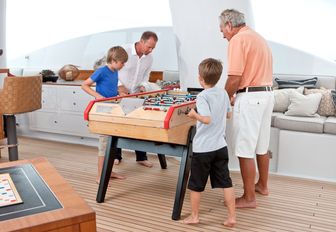charter guests playing games on motor yacht april