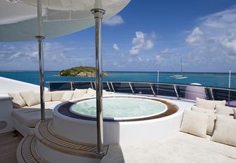 spa pool surrounded by sun pads on the sundeck of luxury yacht ODESSA 
