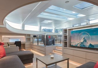 Main salon of sailing yacht G2, with skylight letting in plenty of natural light