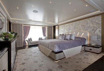 full-beam master suite with hues of silver, cream and lilac on board charter yacht SCORPION