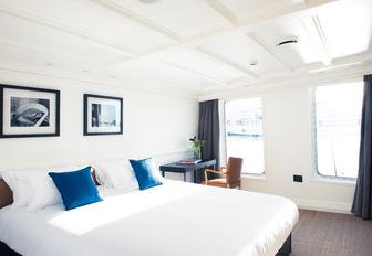 light and airy Hamptons-style master suite on board charter yacht MENORCA