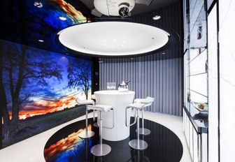 A brightly lit table inside superyacht MYSKY