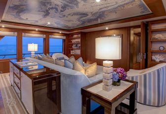 intimate skylounge with ceiling mural on board luxury yacht CYNTHIA