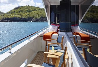 chairs in port-side balcony overlooking the water on board charter yacht ‘Victoria del Mar’ 