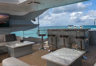 bar and seating area on the sundeck of charter yacht Grey Matters