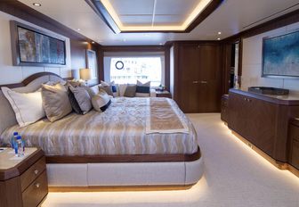 large bed in the master suite of luxury yacht The Rock 