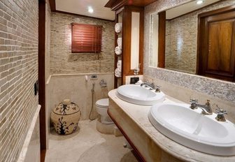 master en-suite bathroom with his-and-hers sinks and intricate tiling aboard sailing yacht Mutiara Laut 