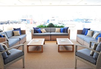 stylish alfresco lounge with sofas and chairs on board luxury yacht ‘Indian Empress’ 