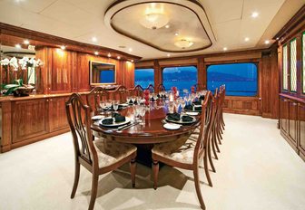 formal dining area in the main salon of charter yacht One More Toy  