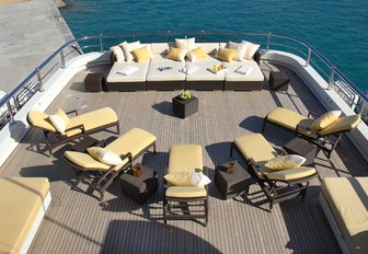 aft section of the sundeck aboard motor yacht ROMA with chaise loungers and sun pads