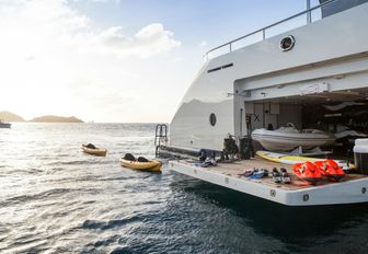 side opening door reveals water toys aboard charter yacht ‘Grace E’ 