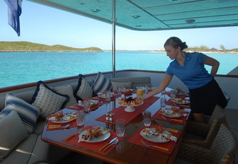 shaded main deck aft set up for alfresco dining on board luxury yacht ‘Sweet Escape’