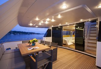 Alfresco dining space on aft deck of luxury yacht SUD