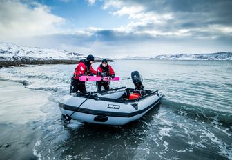 tender aboard luxury yacht FIREBIRD transports ski equipment to the shore in Norway