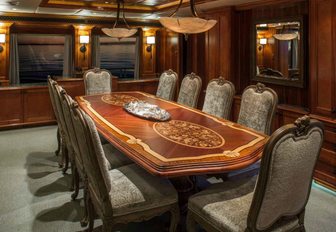 classically styled formal dining area aboard charter yacht UNBRIDLED 