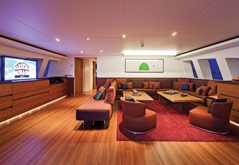 Seating area facing TV in the skylounge aboard motor yacht JEMS