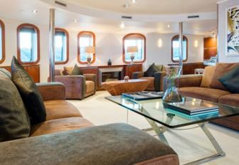 sumptuous seating area in the main salon of luxury yacht SHERAKHAN