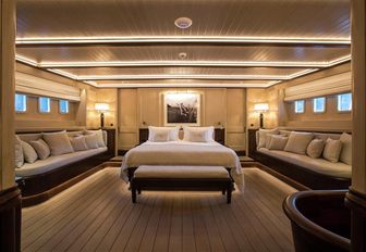 master suite flanked by lounge seating on board sailing yacht SATORI