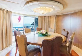 circular table forms formal dining option in the main salon of superyacht Benita Blue 
