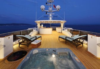 Jacuzzi, chaise loungers and bar on sundeck of superyacht ‘Rima II’ 