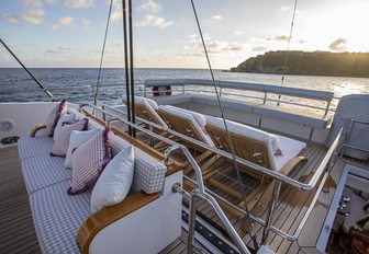 seating area and teak loungers on the flybridge of superyacht BLUSH 