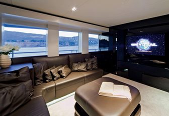 sofa and widescreen TV on board charter yacht JEMS