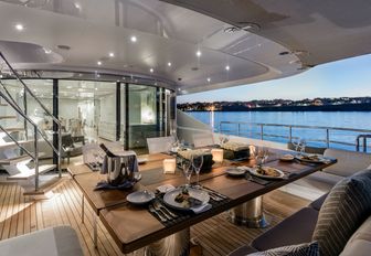 alfresco dining area on the aft deck of charter yacht Her Destiny