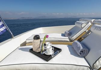 tray with coffee on placed on a sun lounger on the flybridge of charter yacht ASTARTE 