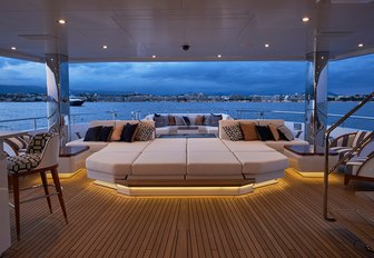plush seating in luxury superyacht JOYin the evening illuminated by custom LED lights