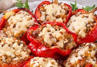 a plate of red peppers stuffed with mincemeat