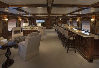expansive skylounge with bar and seating areas aboard motor yacht ‘Silver Lining’ 
