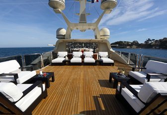 the plush chaise lounge of charter yacht bash locted on her aft sun deck