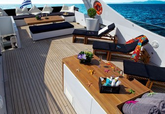 Sundeck on board motor yacht tropicana with sun loungers and seating area