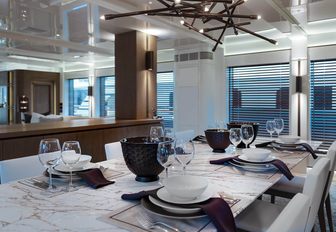formal dining table in the main salon of motor yacht Liquid Sky 