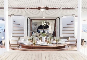 dinning table on the main deck aft of superyacht MENORCA is set up for dinner
