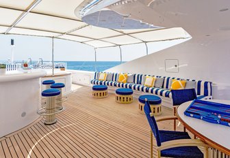 newly upholstered sundeck with bar and seating areas on board superyacht Air