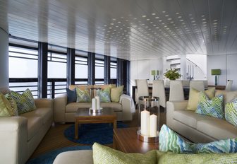 sofas form a lounge in the main salon of motor yacht ‘Ocean Emerald’ 